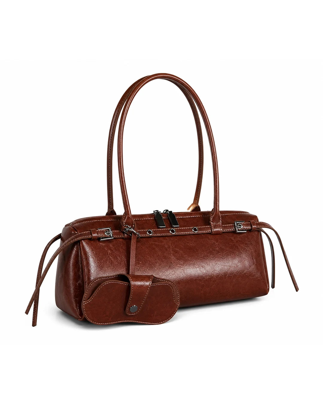 Bolsa feminina de couro marrom Celinne em vista frontal sobre fundo cinza claro, evidenciando o formato alongado, as alças duplas, os detalhes metálicos e o porta-óculos acoplado.