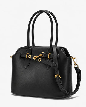 Bolsa feminina Aveline em couro preto, vista angular, mostrando a estrutura ampla, as alças duplas, a alça transversal regulável e as ferragens douradas.