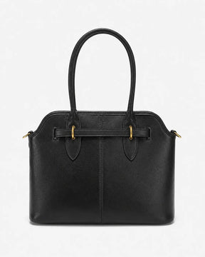 Bolsa feminina Aveline em couro preto, vista traseira, com acabamento liso, costura vertical central e alças duplas.