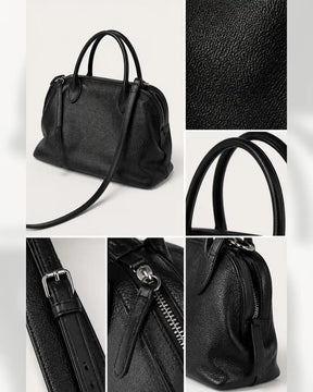 Detalhes da bolsa feminina de couro preta Vivienne, mostrando textura, alças, fivela, zíper e mosquetão.