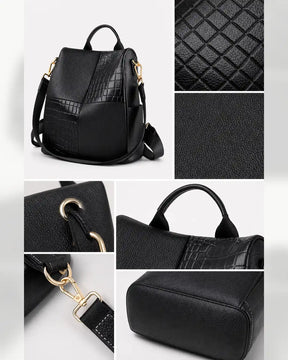 Detalhes da mochila feminina de couro preta Elvienne, destacando textura, acabamento, ferragens douradas, alças e base reforçada.