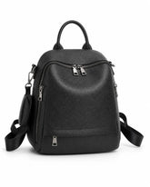 Mochila feminina de couro preta Serelle em vista frontal, com alça de mão, bolsos externos com zíper e detalhe lateral removível.
